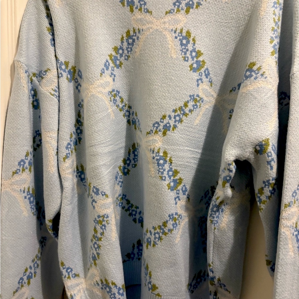 Main Strip Blue and White Textured Knit with bows and flowers 
Brand New